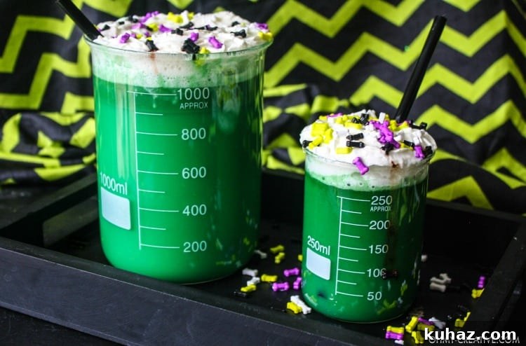 Mad scientist green Halloween drinks for kids served in beakers.
