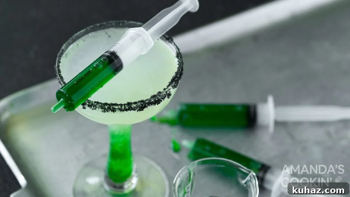 Frankenstein margarita with tequila, lime juice, and black lava salt rim.