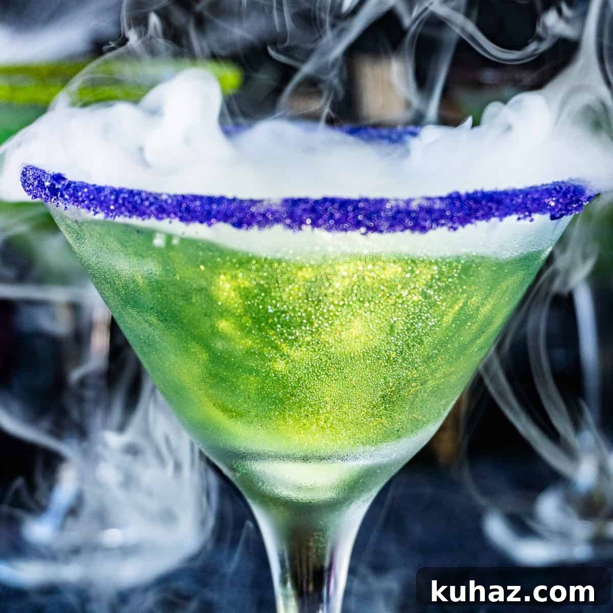 Green Witches Brew cocktail with Sprite and rum for Halloween.