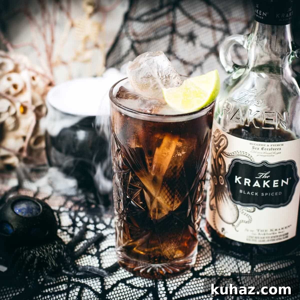 Kraken Cola Halloween rum cocktail served with spider web decoration.