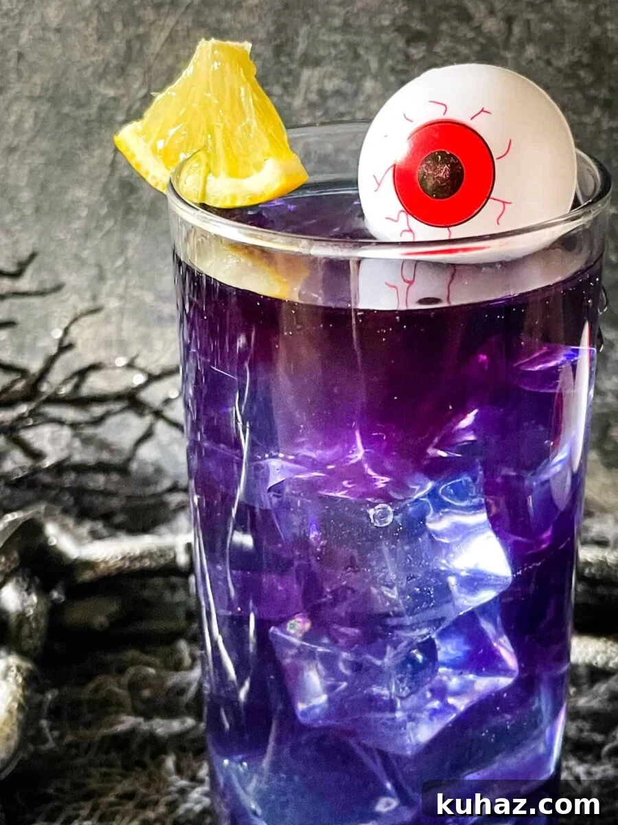 Purple People Eater Halloween cocktail and mocktail with lemon flavor.