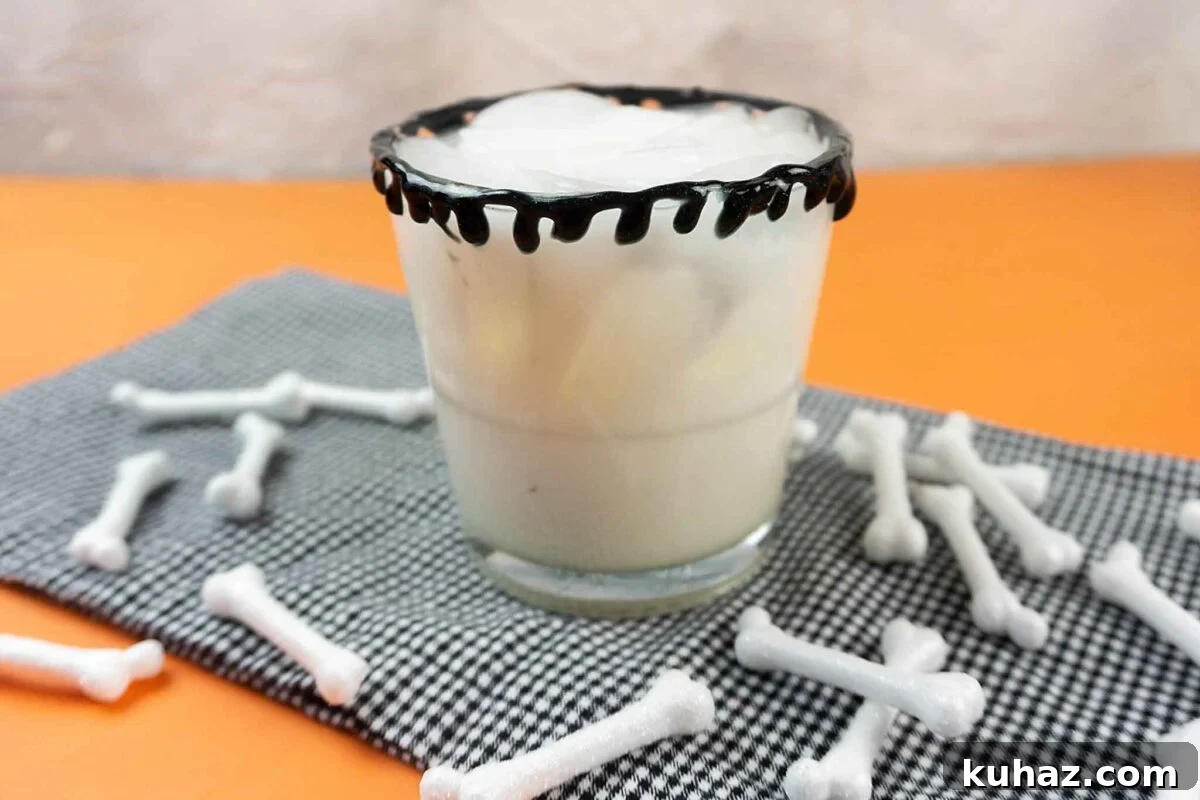 Jack Skellington Bone white Halloween cocktail with chocolate liqueur, vodka, and milk.