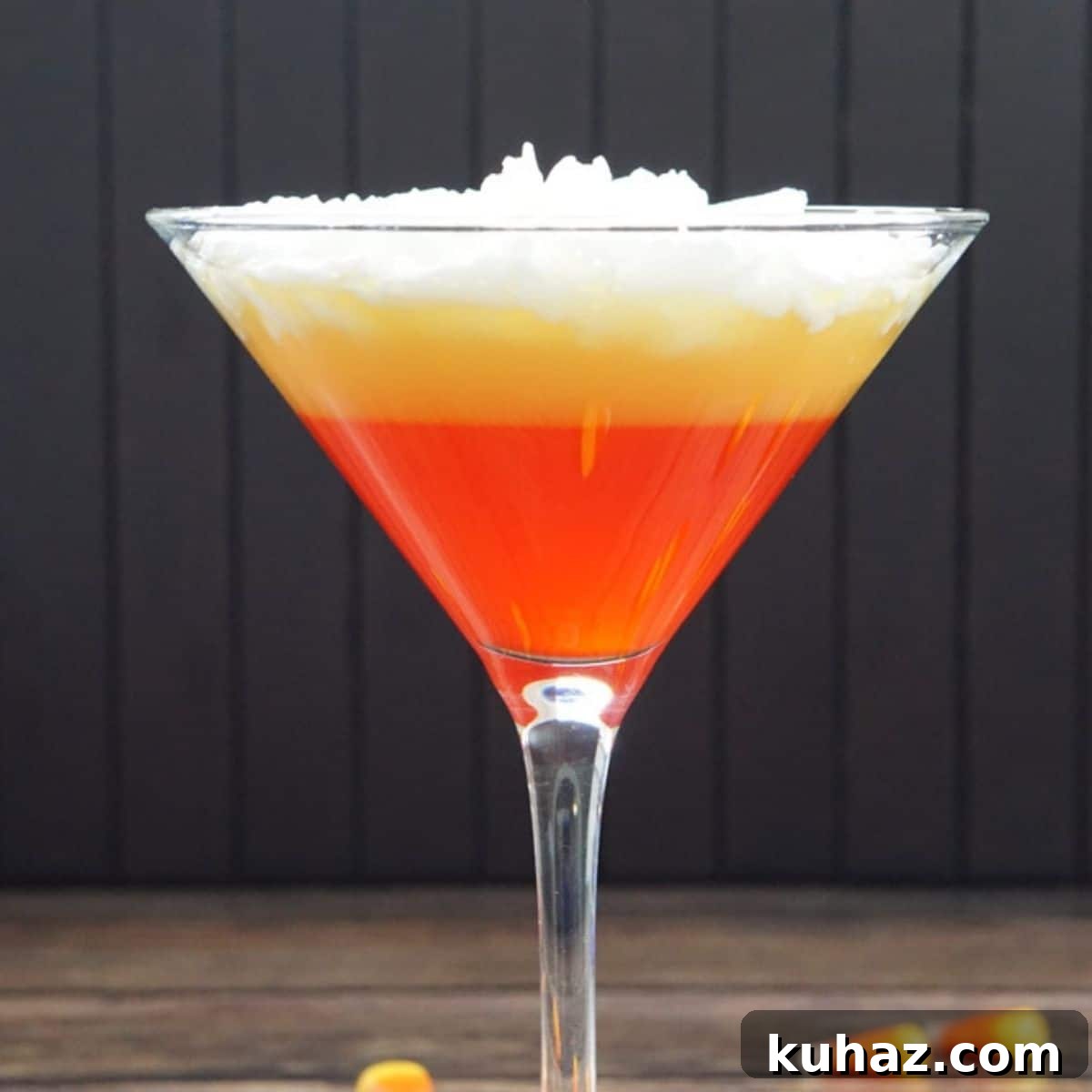 Candy Corn Martini with festive orange, yellow, and white Halloween colors.