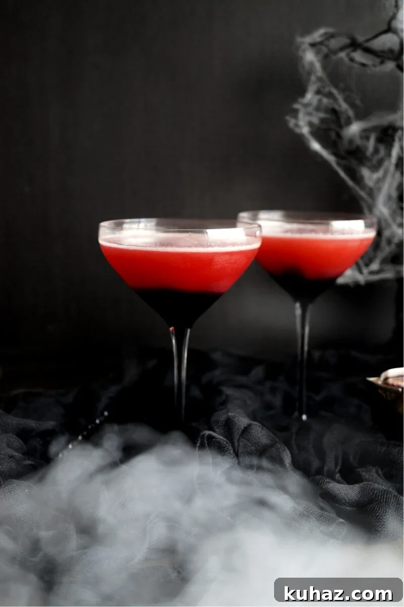 Vampire’s Kiss cocktail with dark cherry syrup, lime, kombucha, and bourbon.