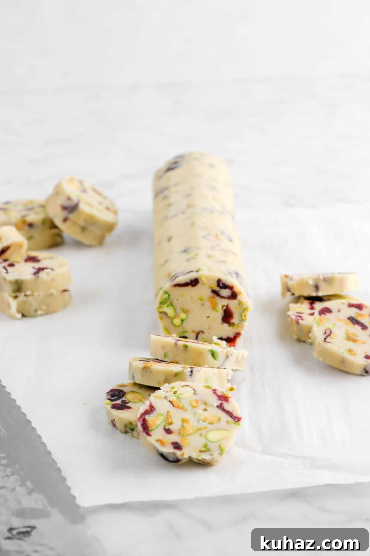 Cranberry Pistachio Slice-and-Bake Cookie Recipe 14 cookie dough cut into rounds on parchment paper