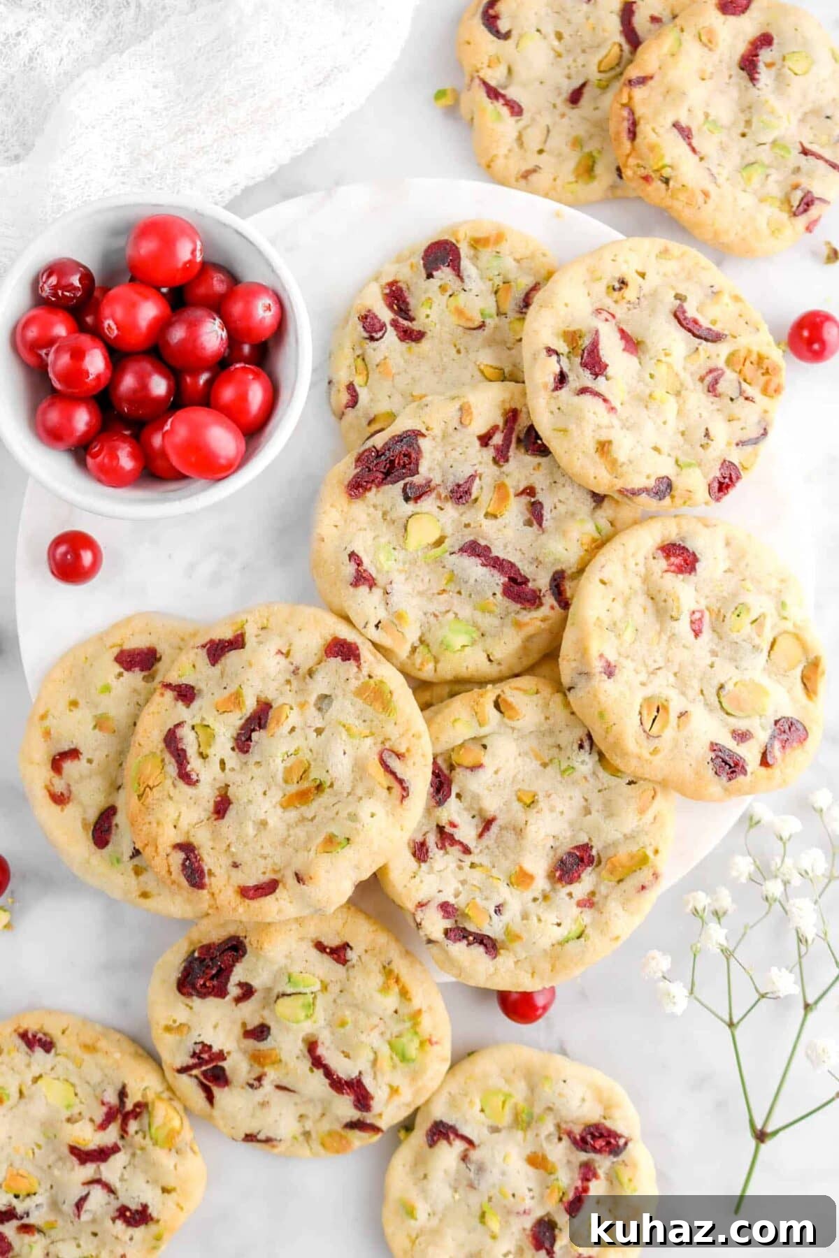 Cranberry Pistachio Slice-and-Bake Cookie Recipe 6 over head of twelve cranberry pistachio cookies with bowl of cranberries