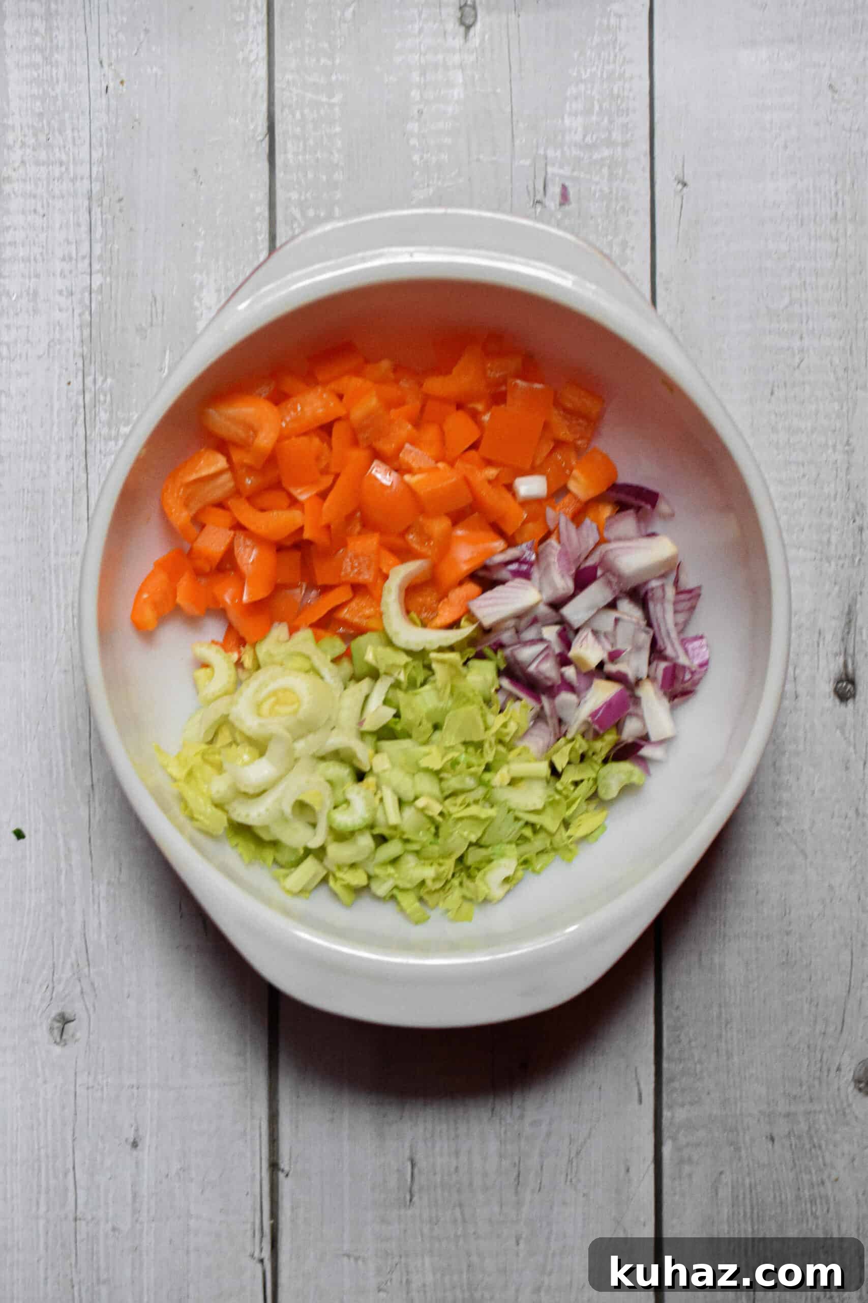 The vegetables are chopped and added to a bowl