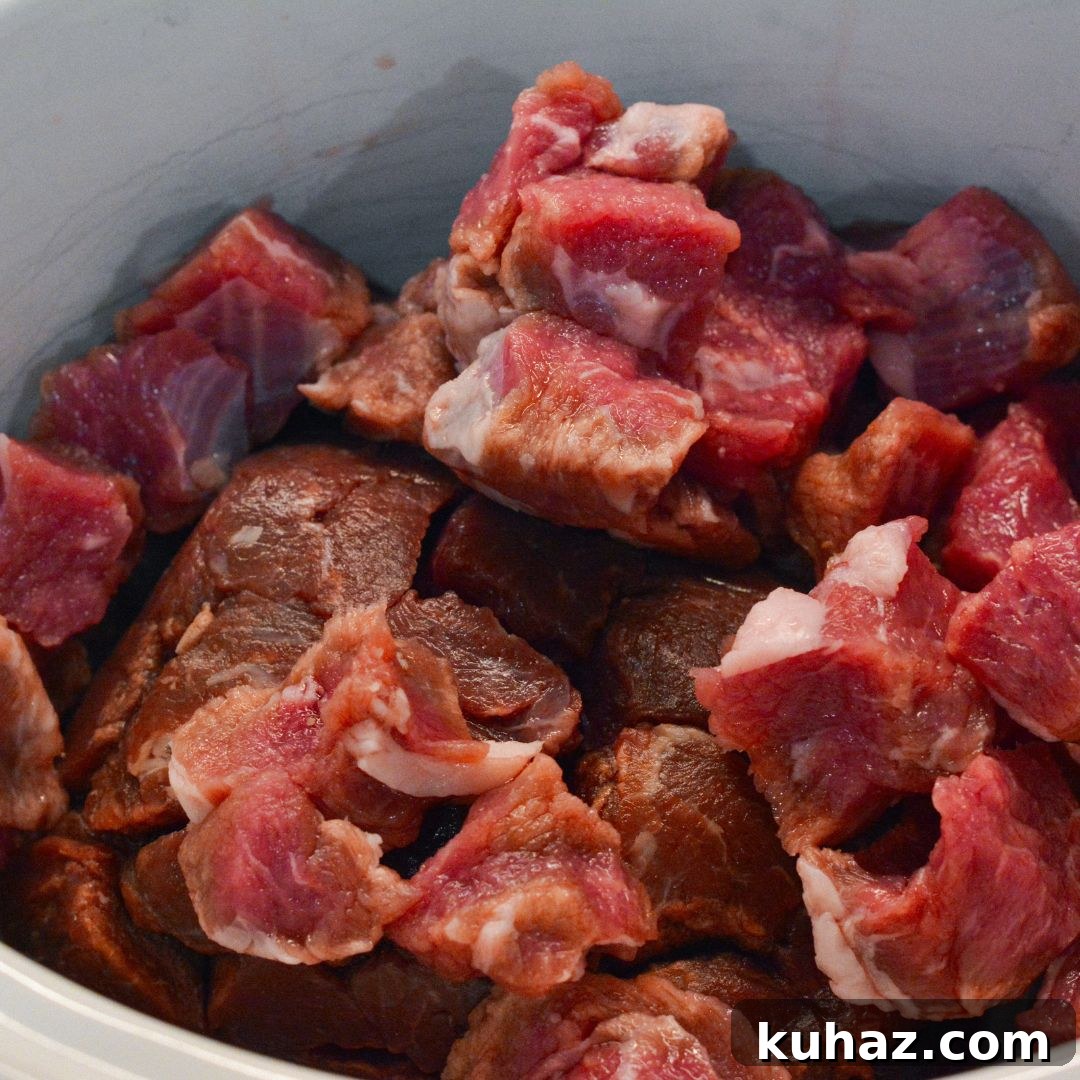 Crock Pot Beef Tips with Mushrooms in Savory Gravy 3 Place beef tips or stew meat in the crock pot.