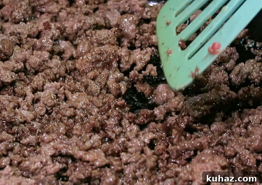 Creamy Ground Beef Stroganoff Recipe with Greek Yogurt 5 cooking the ground beef in a large cast iron skillet for the Ground Beef Stroganoff {with Greek Yogurt}