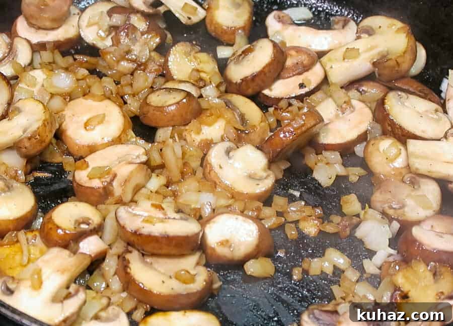 Creamy Ground Beef Stroganoff Recipe with Greek Yogurt 7 sautéed onions and baby bella mushrooms