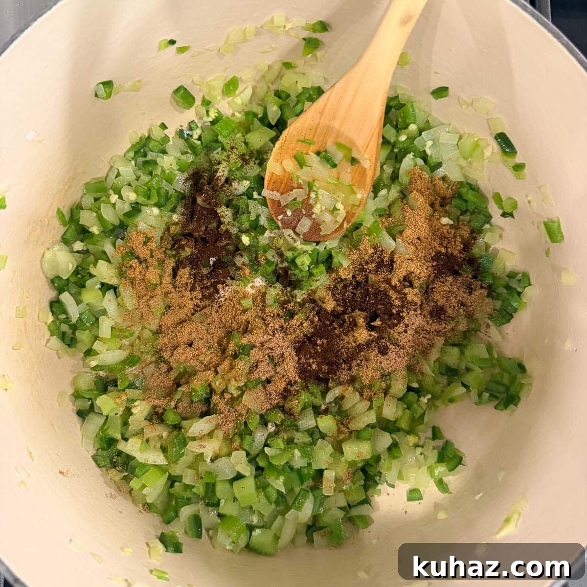 Zesty Tomatillo Soup Recipe with Chicken or Turkey 6 Adding spices to a pot of sautéing vegetables as a soup base.