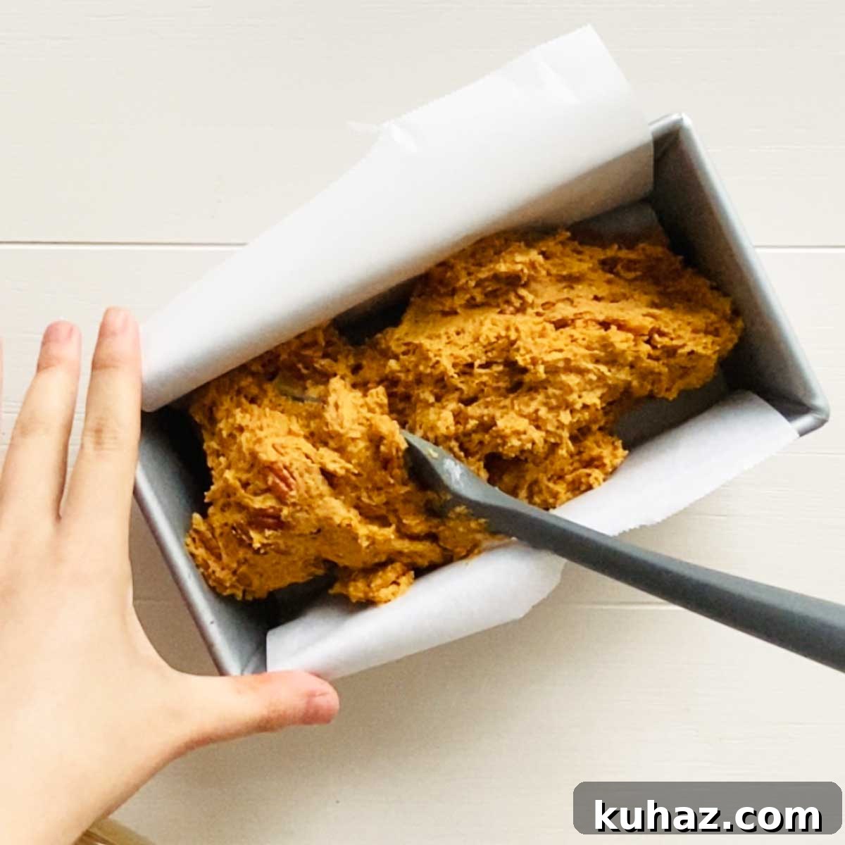 Pumpkin bread batter in loaf pan