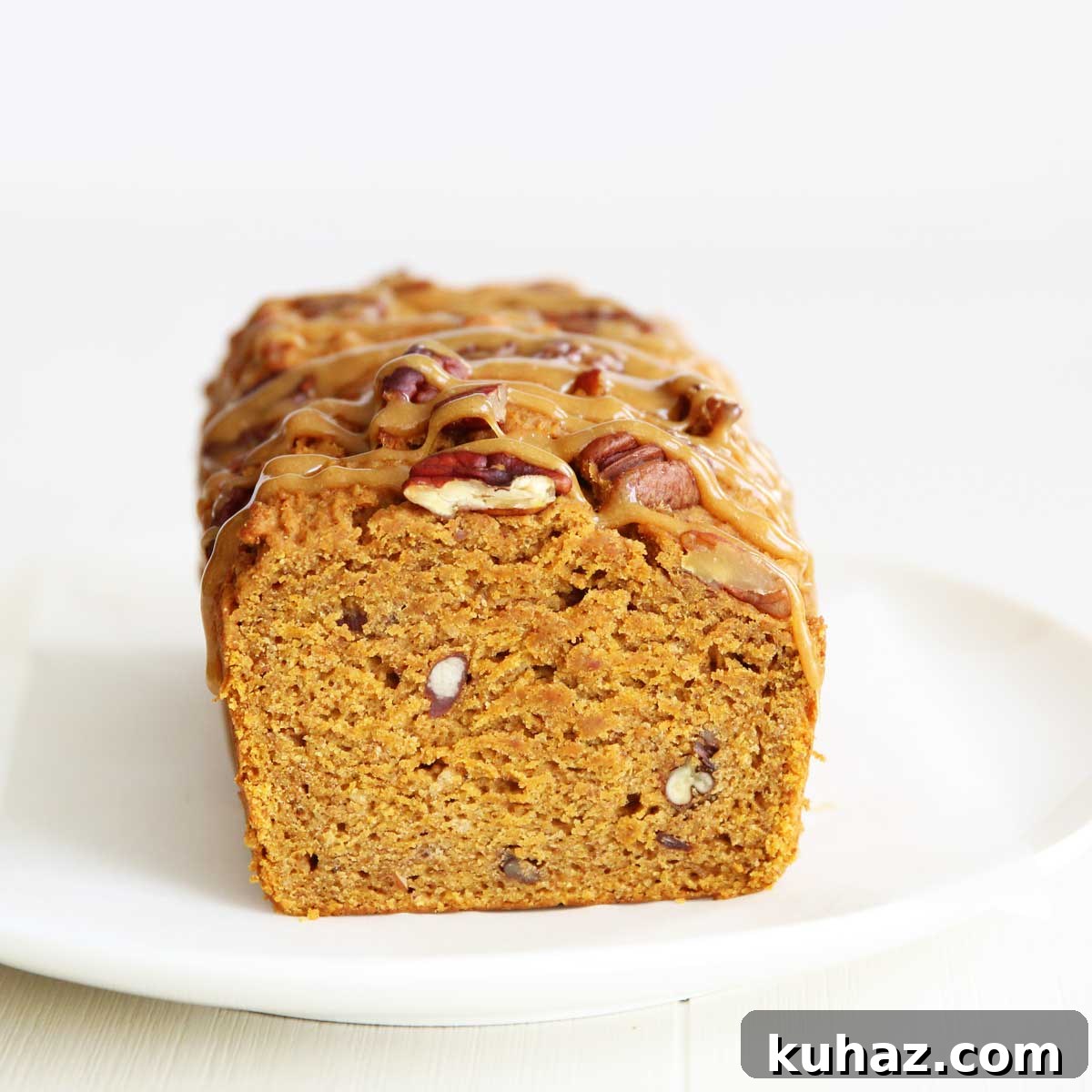 Slice of molasses pumpkin bread with pecans