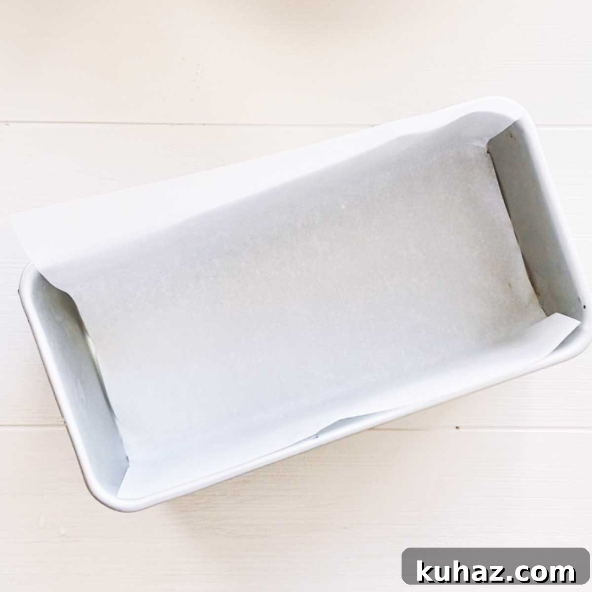 Loaf pan lined with parchment paper