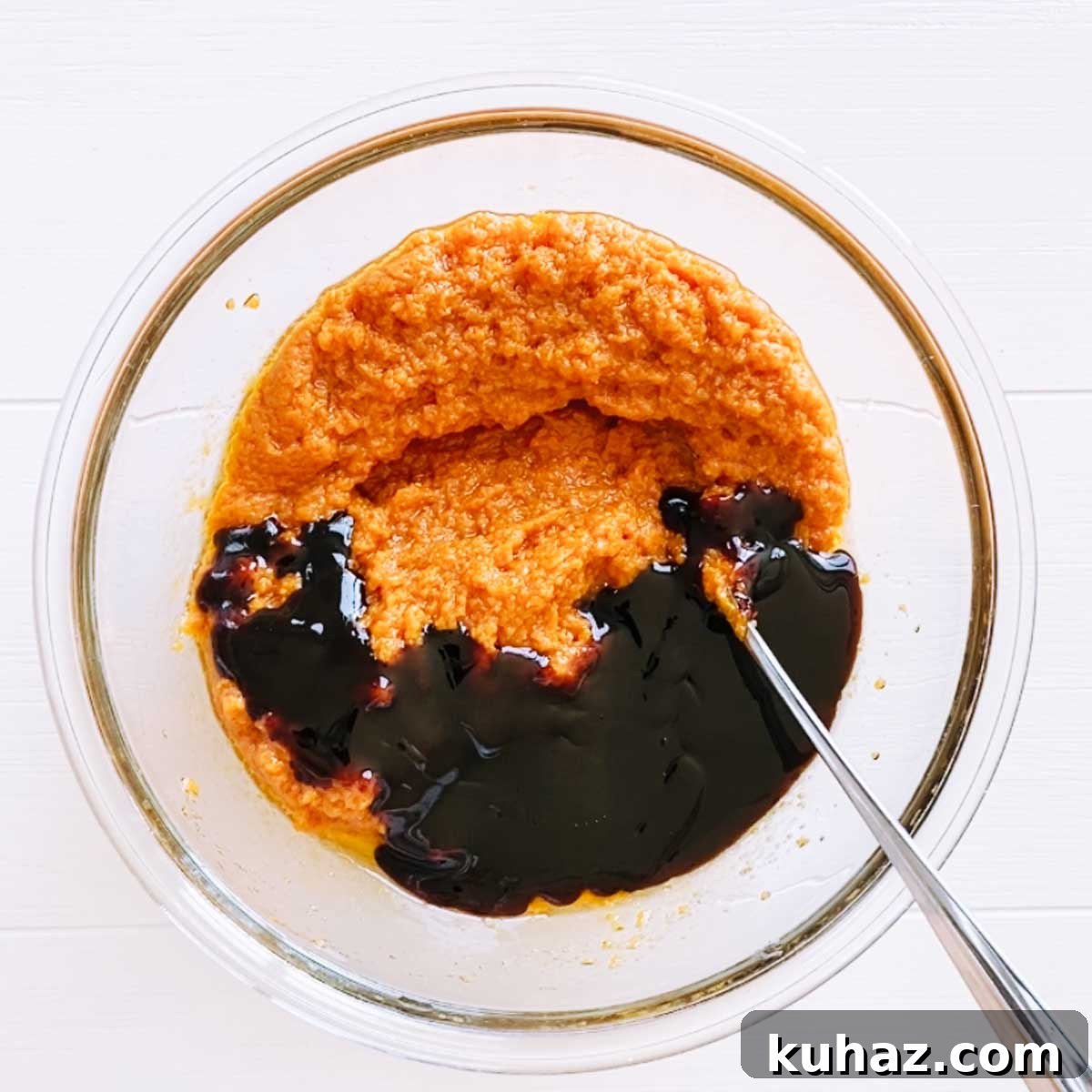 Wet pumpkin bread ingredients in a bowl