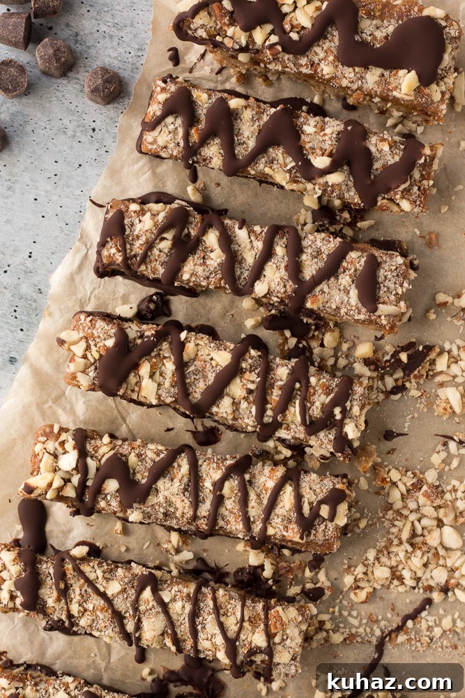 Date, Caramel and Nougat Bars Recipe 2 Date Caramel Nougat Bars sliced into bars on parchment paper