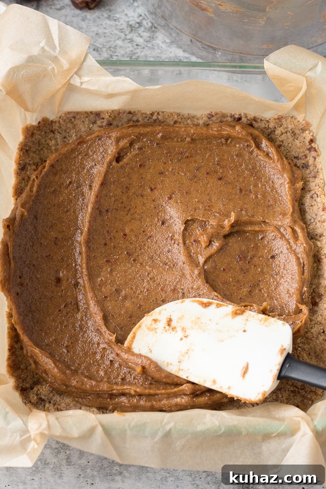 Date, Caramel and Nougat Bars Recipe 4 date caramel spread on top of vegan nougat in baking dish