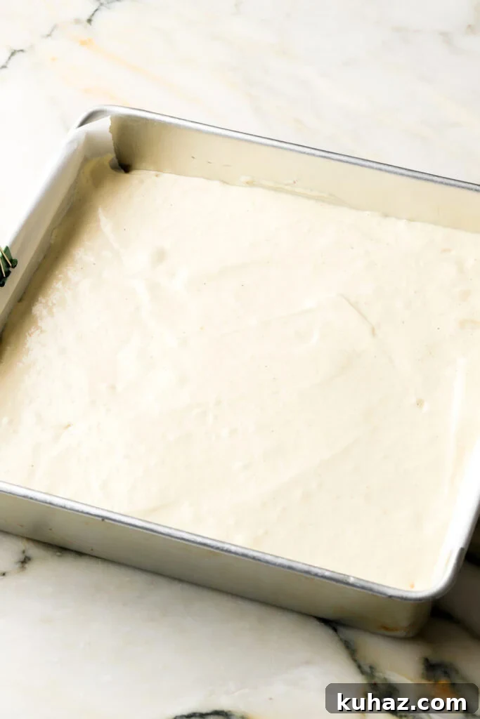 Classic Tiramisu Sheet Cake with Coffee Mascarpone 7 cake batter in prepared pan
