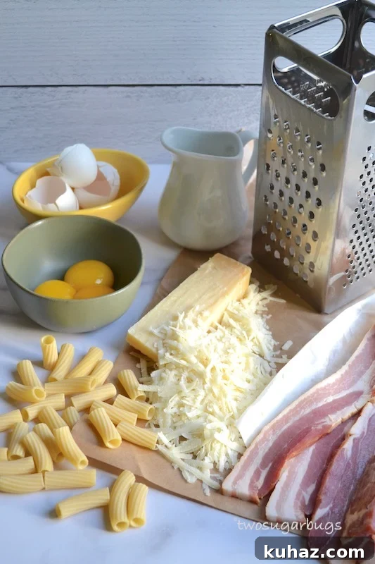 Favorite Pasta Carbonara. Comes together quickly with five ingredients, perfect for a busy night, but special enough for a dinner party. #twosugarbugs #pastacarbonara #pasta #dinnerisserved