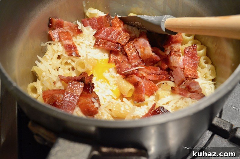 Favorite Pasta Carbonara. Comes together quickly with five ingredients, perfect for a busy night, but special enough for a dinner party. #twosugarbugs #pastacarbonara #pasta #dinnerisserved