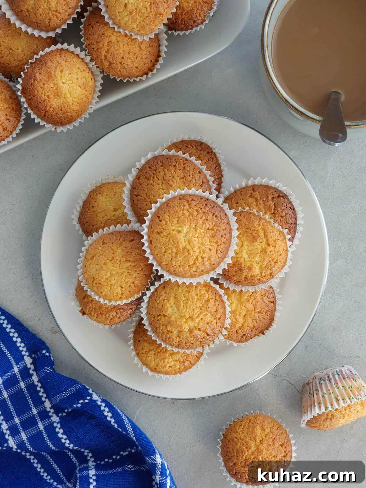 Filipino Coconut Macaroons with Condensed Milk 2 filipino-style coconut macaroons on a white plate.