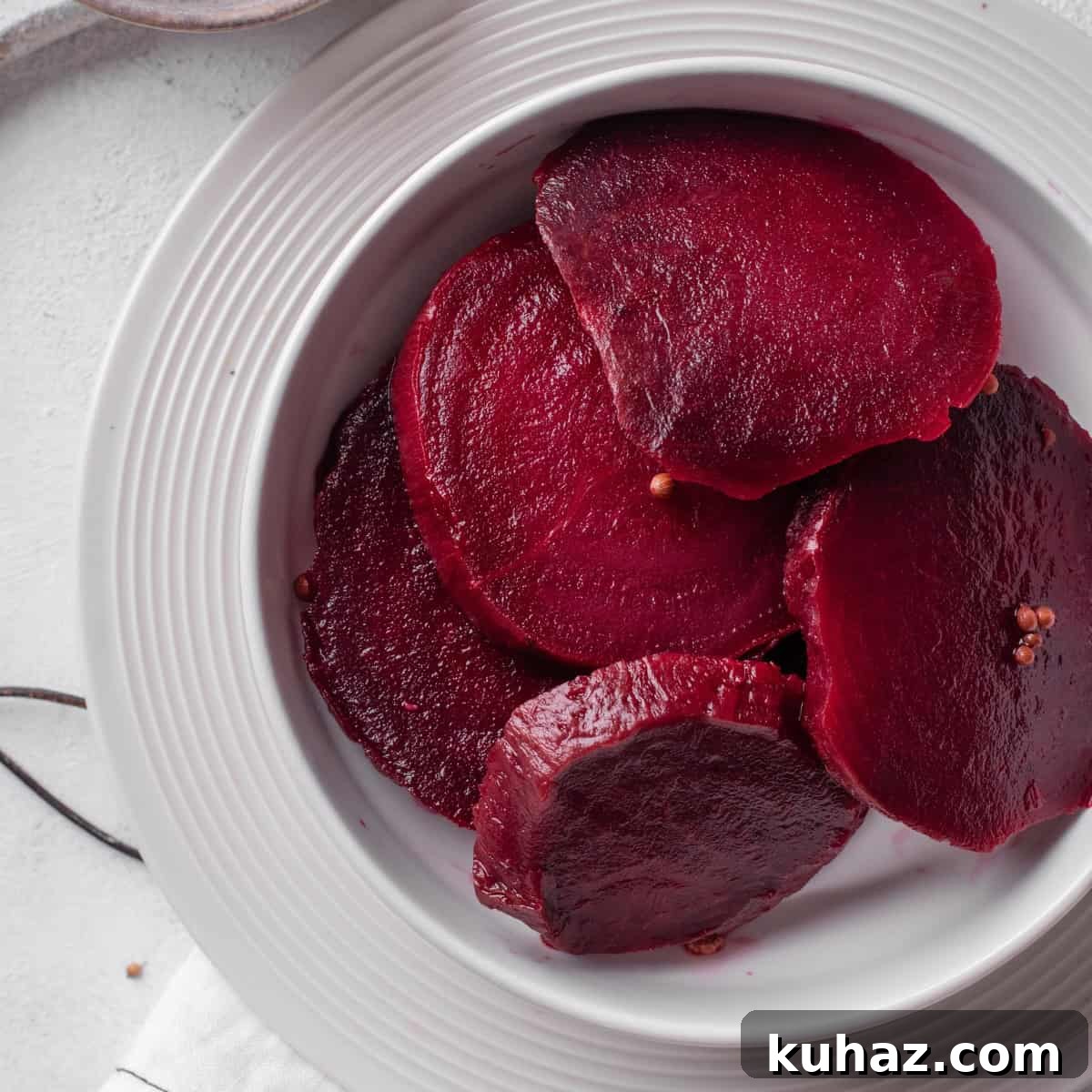 Pickled Beets Recipe with Vinegar and Dill 2 Pickled beetroot served on a white plate.