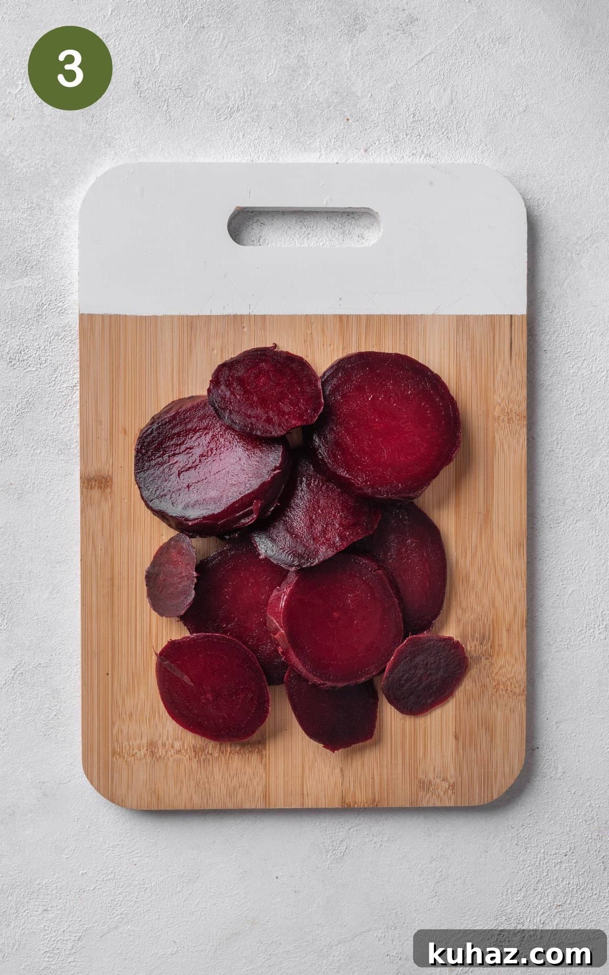 Pickled Beets Recipe with Vinegar and Dill 6 beets cut in pieces on a wooden cutting board.