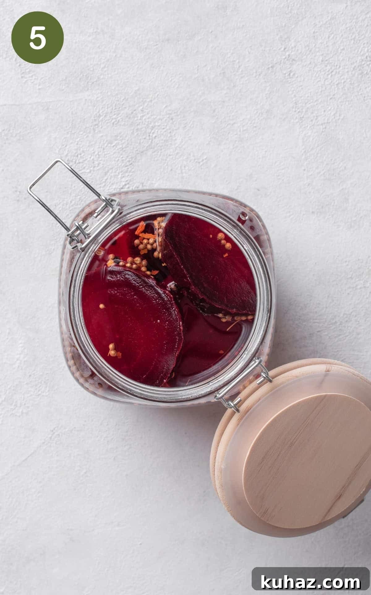 Pickled Beets Recipe with Vinegar and Dill 8 beets in a clean glass jar with the mixture.