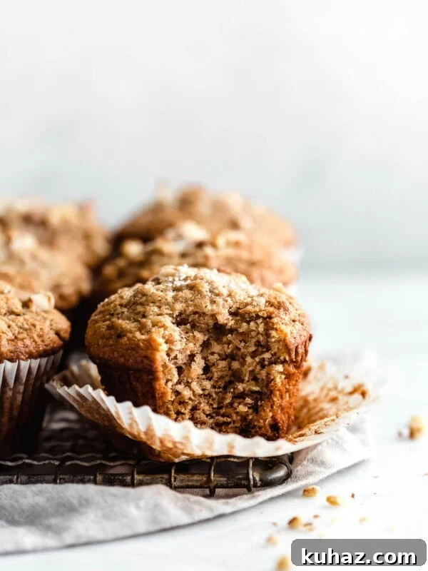A banana nut muffin with a bite taken out of it