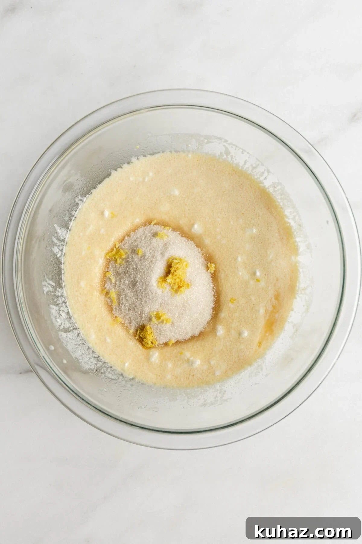 cottage cheese, milk ,egg, oil and vanilla mixed up with sugar and lemon zest in a mixing bowl.