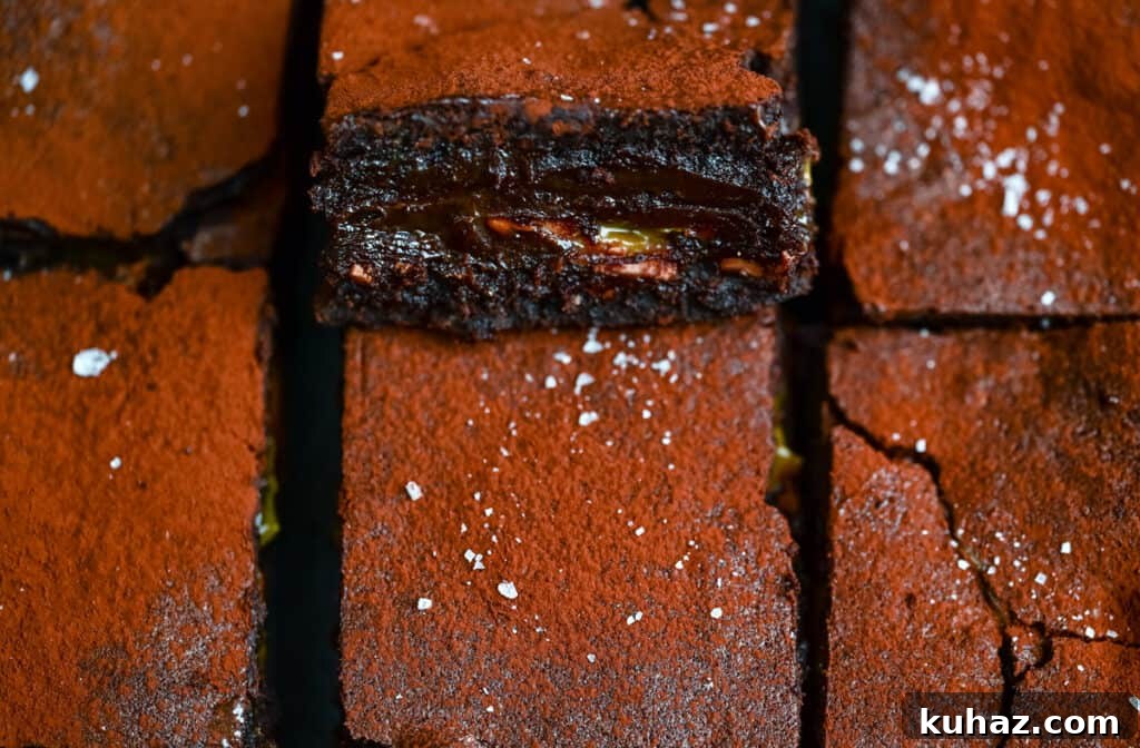Salted Caramel Brownies Recipe with Gooey Caramel Swirls 9 Close up of sliced caramel brownies