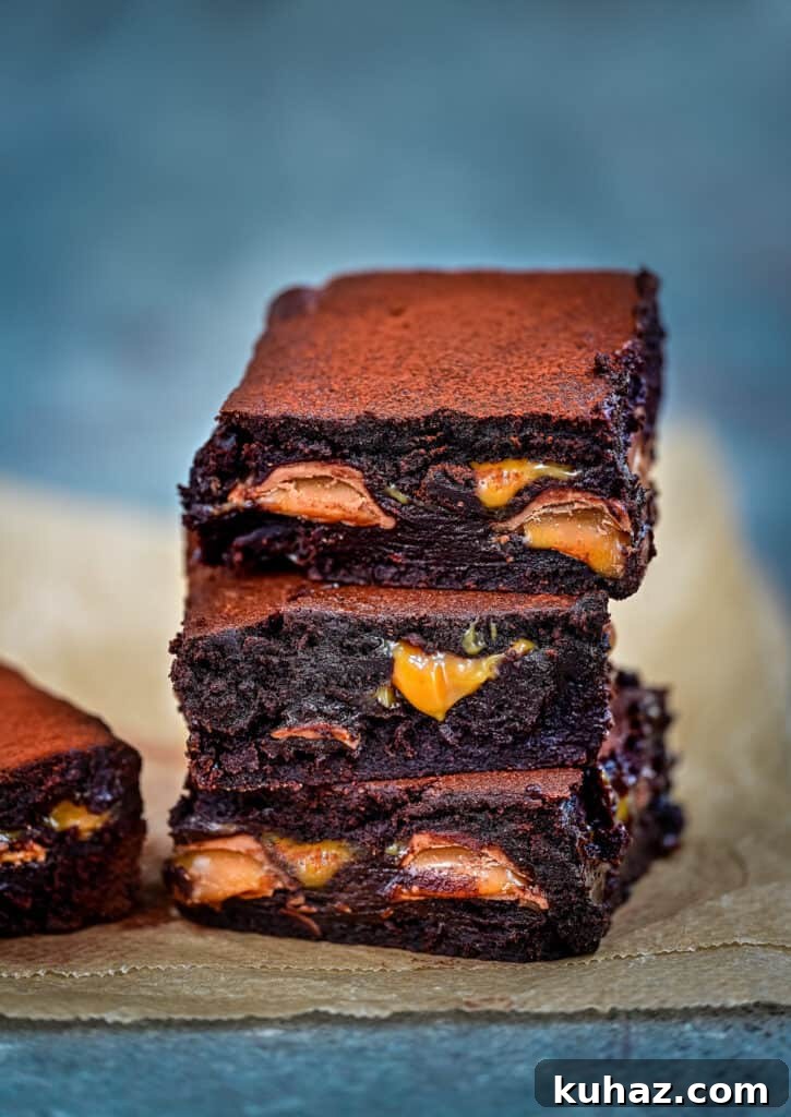 Salted Caramel Brownies Recipe with Gooey Caramel Swirls 10 Three squares of chocolate brownies stuffed with caramel