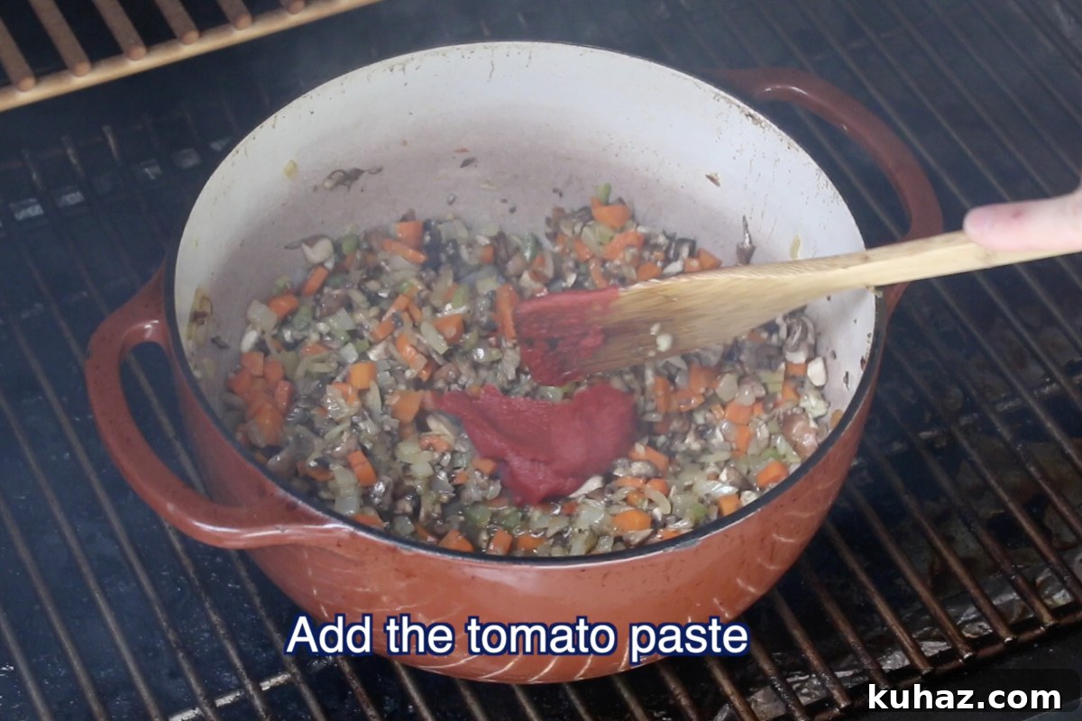 Adding tomato paste to soffritto in dutch oven for ragu