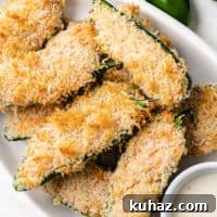 Crispy Oven-Baked Jalapeno Poppers with Cream Cheese 6 Close up view of jalapeño poppers on a plate.