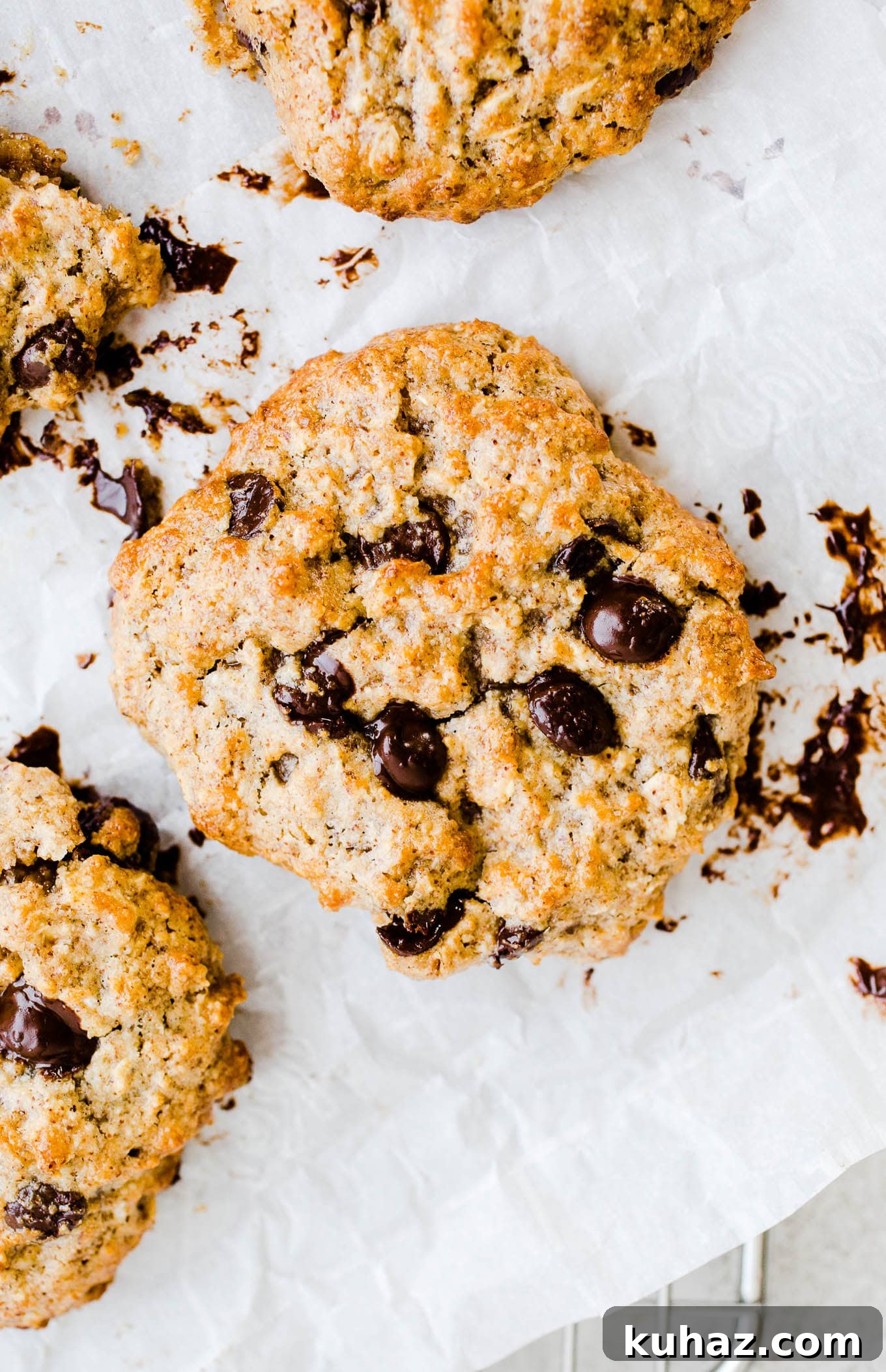 Air fryer oatmeal chocolate chip cookies on parchment paper.