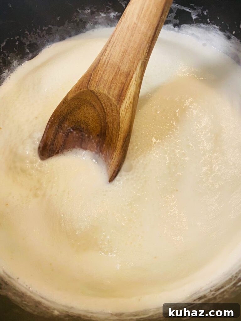 Creamy Pesto Salmon Pasta 4 starting the sauce with heavy cream