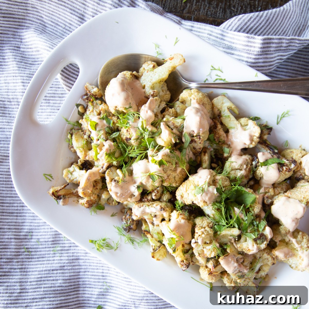 Crispy Roasted Cauliflower with Tahini and Dates 2 Zaatar roasted cauliflower, tossed with harissa tahini, dates and fresh herbs.