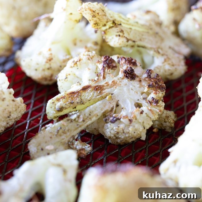Crispy Roasted Cauliflower with Tahini and Dates 4 Za'atar roasted cauliflower in an air fryer basket.