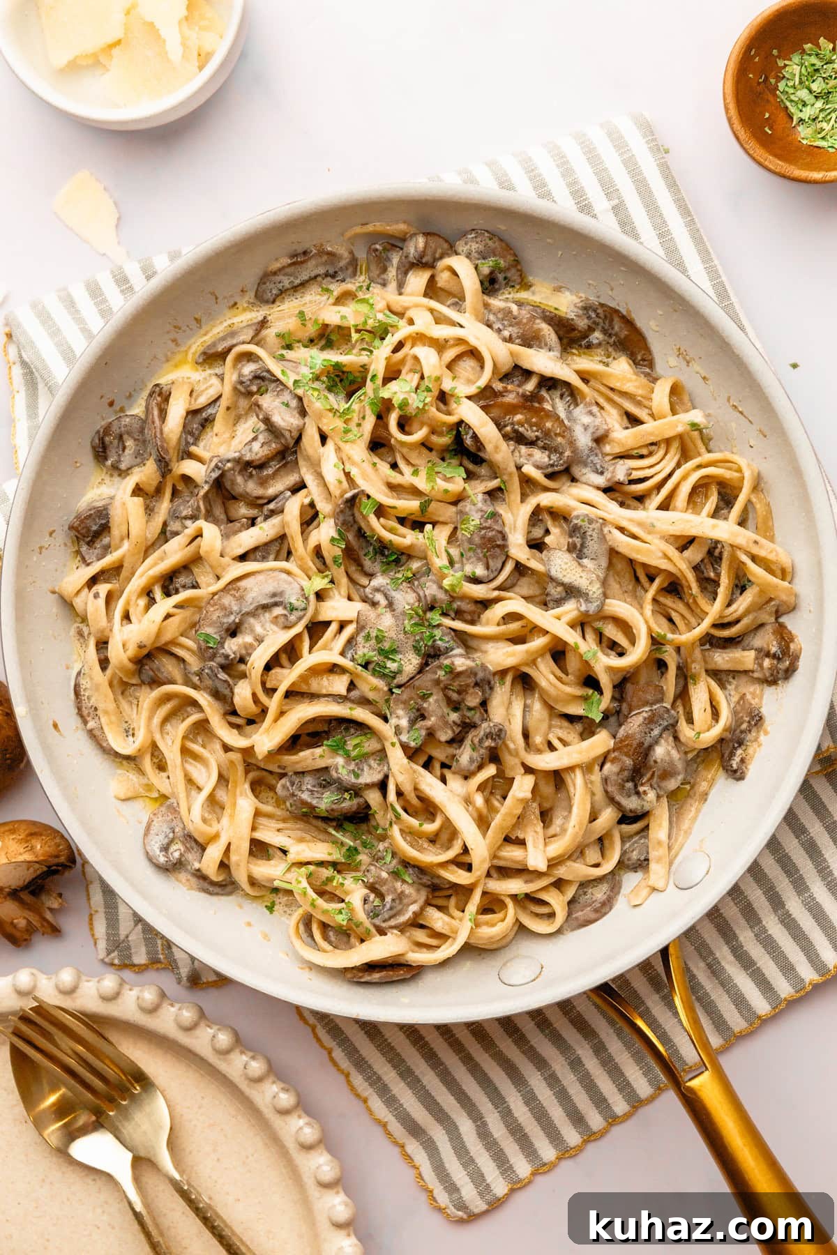 Creamy Mushroom Pasta with Garlic and Parmesan 2 An overhead image of creamy mushroom pasta on a skillet, ready to serve.