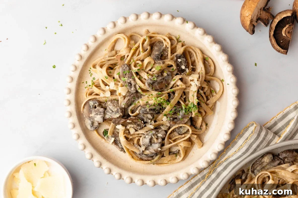Creamy Mushroom Pasta with Garlic and Parmesan 9 An overhead image of creamy mushroom pasta on a serving plate.