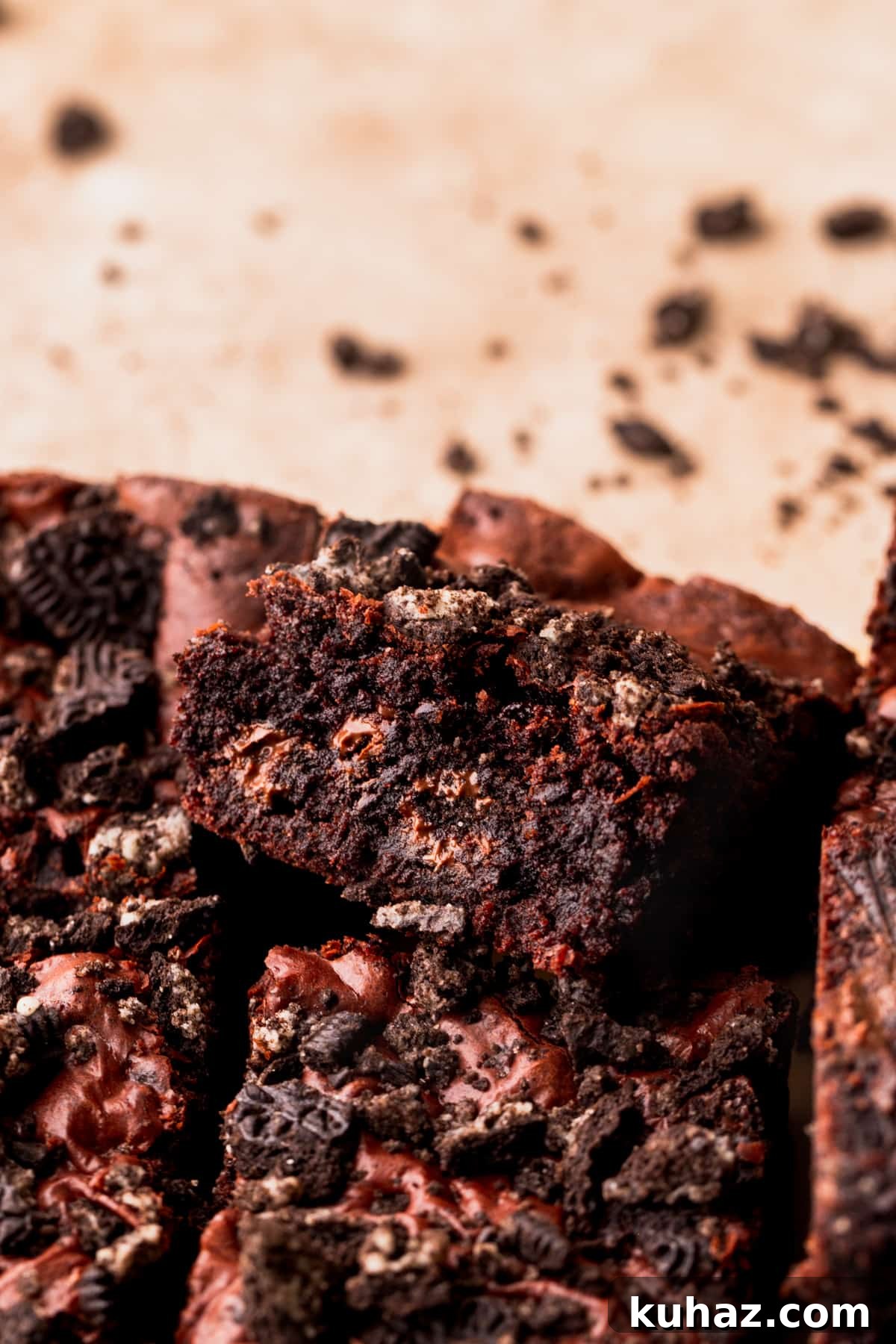 Fudgy Oreo-Stuffed Brownies Recipe 3 One oreo brownie on its side.