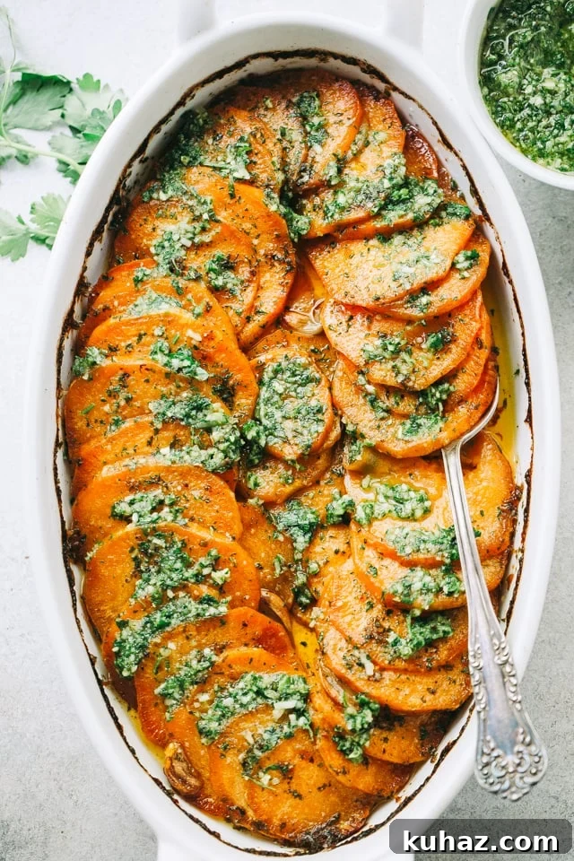 Sweet potatoes fanned out in a baking dish and topped with parsley pesto.