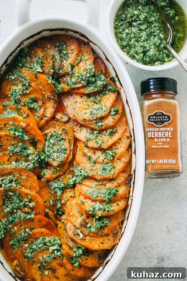 Overhead view of Sweet Potato Roast with Parsley Pesto in a casserole dish.