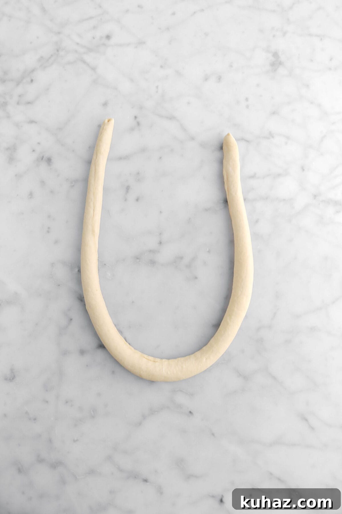 Giant Goat Cheese Stuffed Soft Pretzels 17 dough rope shaped in a, "U" shape.