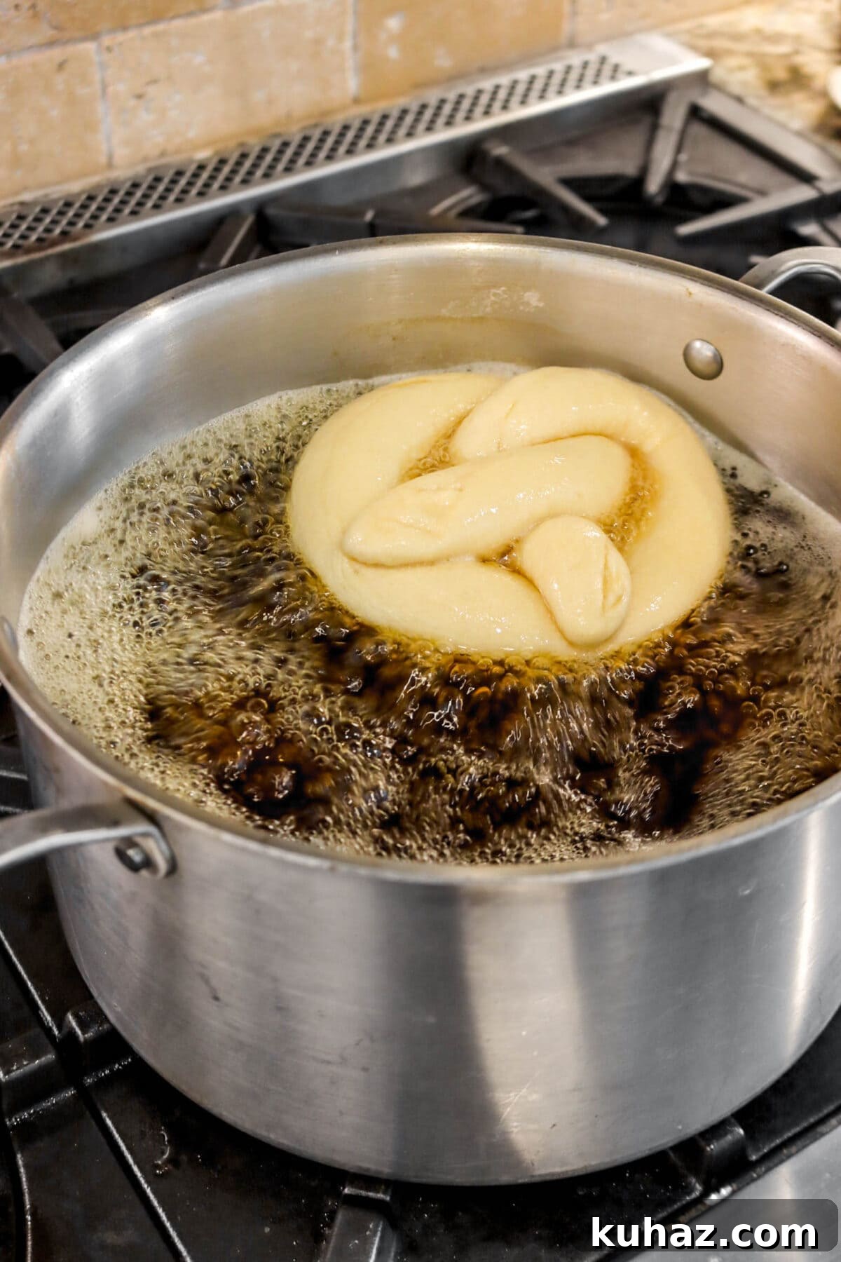 Giant Goat Cheese Stuffed Soft Pretzels 22 pretzel being boiled.