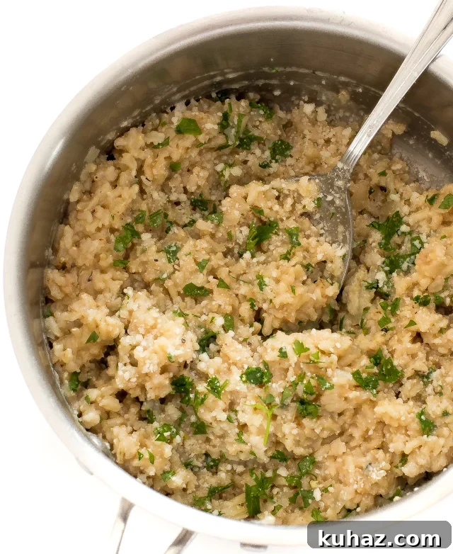 Zesty Lemon Parmesan Brown Rice Recipe 2 overhead shot of brown rice in saucepan with parsley and parmesan cheese