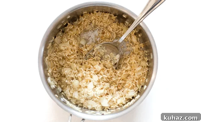 Zesty Lemon Parmesan Brown Rice Recipe 4 sautéing brown rice and onion in skillet
