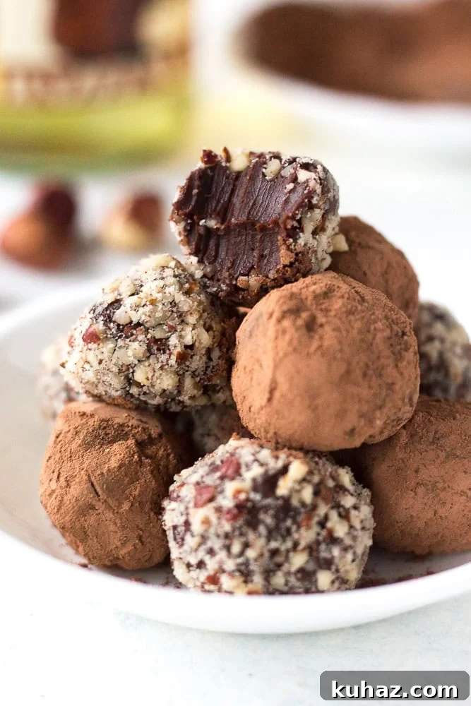 Homemade Chocolate Hazelnut Rum Truffles Recipe 2 hazelnut rum truffles on a plate