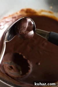 Homemade Chocolate Hazelnut Rum Truffles Recipe 11 scooping out rum truffle mixture with a spoon
