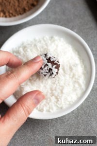Homemade Chocolate Hazelnut Rum Truffles Recipe 14 rolling a rum truffle in coconut flakes